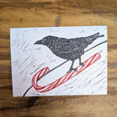 Sledding Crow Greeting Card